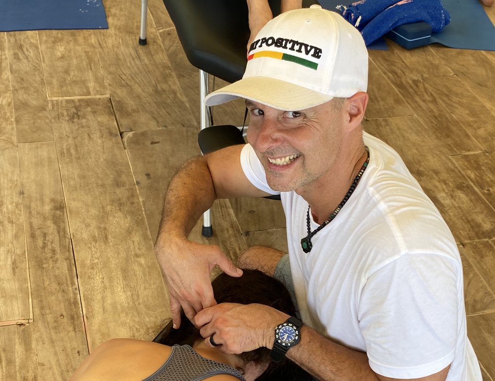 Dr. Matt Lyon working with a guest during a hands-on healing session